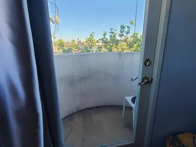 a view from a door of a room with a window at Guest Room in Sherman Oaks with private bathroom and balcony in Sherman Oaks