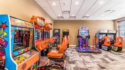 a gaming room with arcade games and video games at ROM2112 in Los Angeles