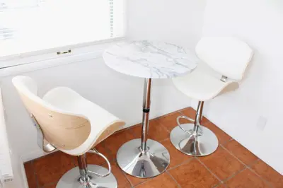 a table and two chairs in a room at Los Angeles Cherry Blossom in Monterey Park