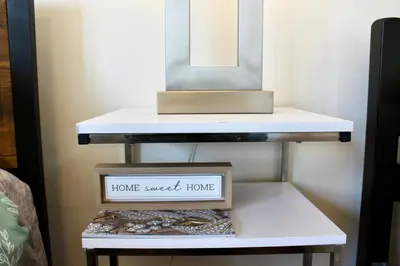a shelf with a home sweet home mirror on it at Los Angeles Cherry Blossom in Monterey Park