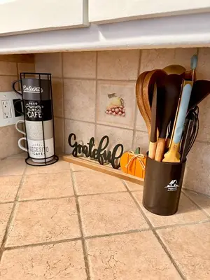 a kitchen counter with a container of cooking utensils at Los Angeles Cherry Blossom in Monterey Park