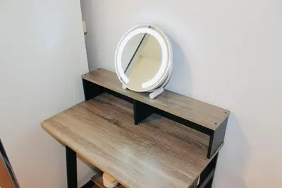 a mirror sitting on top of a wooden table at Los Angeles Blue Nest in Monterey Park