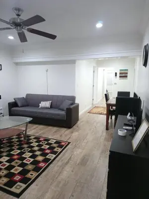 a living room with a couch and a table at Vacation Unit is Available for Business and Family Trip in Long Beach