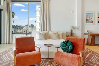 a living room with two chairs and a couch at The Santa Monica Sunset - 5k sq ft beachfront luxury in Los Angeles