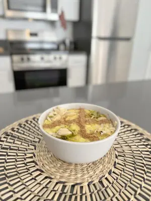 a bowl of soup sitting on a wicker table at Seaside Escape Steps from Santa Monica Beach in Los Angeles