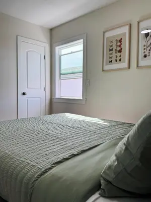 a bedroom with a bed and a window at Cozy Private Room A in S Central LA in Los Angeles
