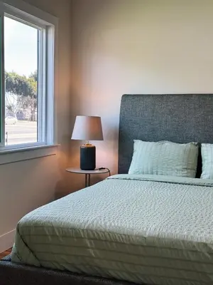 a bedroom with a bed and a window at Cozy private room B in S Central LA in Los Angeles