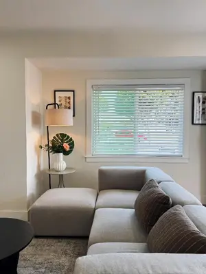 a living room with a couch and a window at Cozy private room B in S Central LA in Los Angeles
