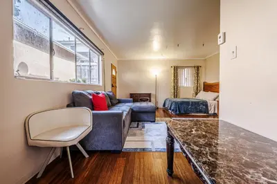 a living room with a couch and a bed at Spacious Single Apt D In Santa Monica in Los Angeles