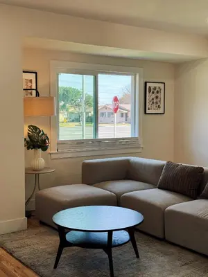 a living room with a couch and a table at Cozy private Room D in S Central LA in Los Angeles