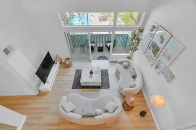 an overhead view of a living room with couches and a tv at High Ceilings 3BR with Loft-2 Baths Pool & Jacuzzi in Tarzana