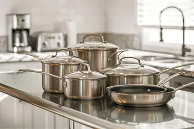 a group of pots on a stove in a kitchen at 5BR Fun Haven Pool Mini Golf Movie Game room in Riverside