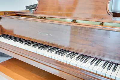 a wooden piano sitting on top of a table at Home 1 Mi to DTLA Room to Work and Relax! in Los Angeles