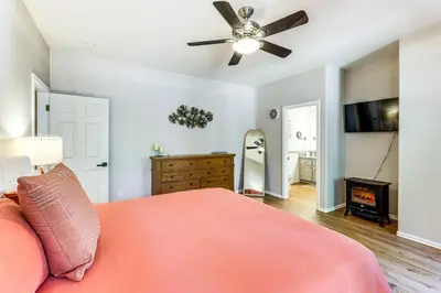 a bedroom with a bed and a ceiling fan at Swim, Hike, Ski and Unwind Lake Arrowhead Retreat! in Lake Arrowhead