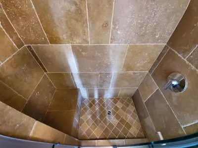 a shower with a tiled ceiling with a metal at The Topanga Bungalow by Colby & Conrad in Topanga
