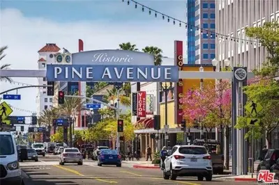 a street sign for pine avenue in a city at Stylish Long Beach Retreat Walk to Beach Bars in Long Beach