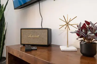 a television sitting on top of a wooden table at Hollywood Apartment Near Walk of Fame in Los Angeles