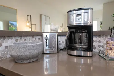 a coffeemaker sitting on top of a kitchen counter at Hollywood Apartment Near Walk of Fame in Los Angeles