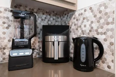 a coffee maker and a blender on a counter at Hollywood Apartment Near Walk of Fame in Los Angeles