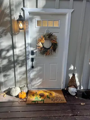 a white door with a welcome mat in front of it at Stunning secluded Creekside A-Frame gameroom in Lake Arrowhead