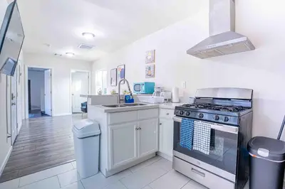 a kitchen with a stove and a sink at Comfy Home Near Sofi Stadium in Los Angeles