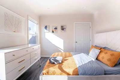 a bedroom with a bed and a white dresser at Comfy Home Near Sofi Stadium in Los Angeles