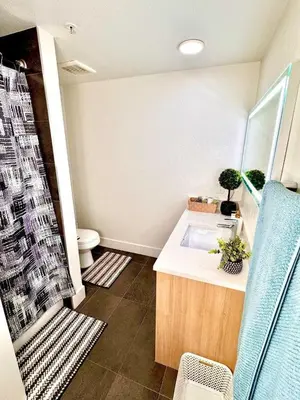 a bathroom with a sink and a shower with a toilet at Beautiful 2bd 2bth apartment in Santa Monica in Los Angeles