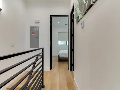 a hallway with a door leading to a bedroom at Modern Luxe Retreat Two-Bedroom in Los Angeles