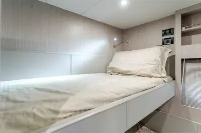 a white bed in a room with a wall at Riva Virtus 65 Yacht Trip w Captain Overnight Stay 2812 in Los Angeles