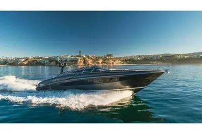 a black boat is on the water at Riva Virtus 65 Yacht Trip w Captain Overnight Stay 2812 in Los Angeles