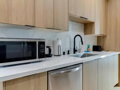 a kitchen with a microwave and a sink at Modern Luxe Retreat Six-Bedroom in Los Angeles