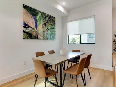 a dining room with a table and chairs at Modern Luxe Retreat Six-Bedroom in Los Angeles