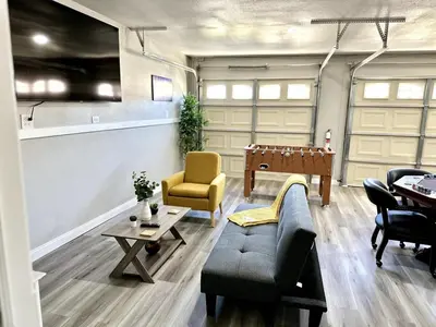 a living room with a pool table and chairs at Cactus Casino with game room next to Yaamava Casino in Highland