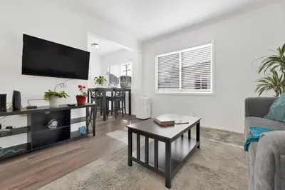 a living room with a couch and a tv at Cozy, Luxurious, Oasis, With Free parking in Los Angeles