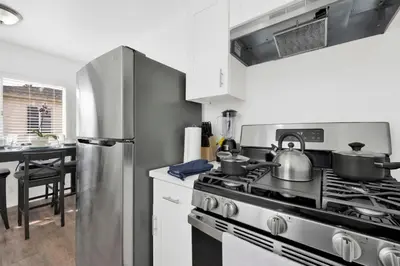 a kitchen with a stove with pots and pans on it at Cozy, Luxurious, Oasis, With Free parking in Los Angeles