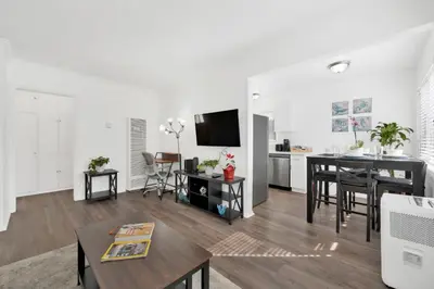 a living room with a table and a dining room at Cozy, Luxurious, Oasis, With Free parking in Los Angeles
