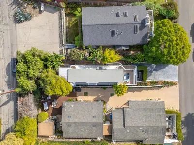 an overhead view of a house with trees and houses at The Hidden Hideaway in Summerland