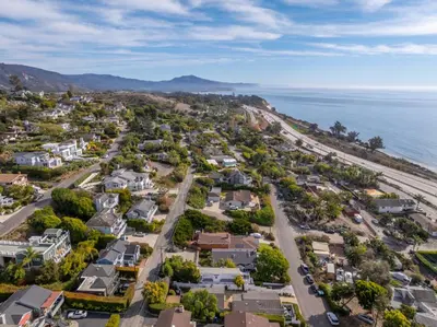 an aerial view of a residential neighborhood next to the ocean at The Hidden Hideaway in Summerland