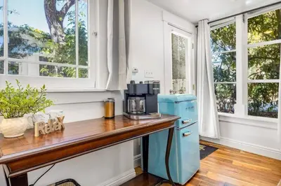 a kitchen with a wooden counter and a blue refrigerator at Jennifers Room - Pet Friendly in Summerland