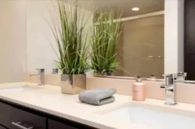 a bathroom counter with two sinks with plants on it at Stunning 2BR Penthouse Patio & View Venice MDR in Los Angeles