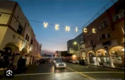 a car driving down a city street with a traffic light at Stunning 2BR Penthouse Patio & View Venice MDR in Los Angeles