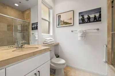 a bathroom with a sink and a toilet and a shower at On Sunset Blvd - 5 star retreat in Los Angeles