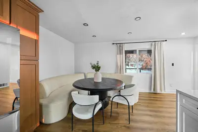 a kitchen and dining room with a table and chairs at THE Cabin in Running Springs