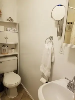a bathroom with a toilet and a sink and a mirror at Studio in Southbay close to the beach SoFi stadium LAX in Lawndale