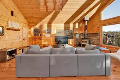 a living room with a couch and a fireplace at High-Top Lakeview Chateau #2520 in Fawnskin