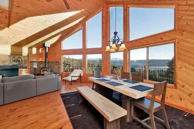 a dining room with a table and a couch at High-Top Lakeview Chateau #2520 in Fawnskin