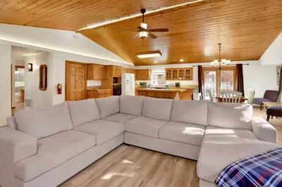 a living room with a couch and a kitchen at Oriole House #2518 in Big Bear Lake