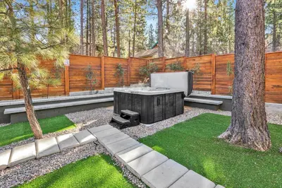 a backyard with a tv and a fence at Oriole House #2518 in Big Bear Lake