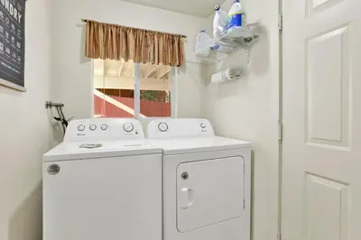 a white washer and dryer in a small room at Green Squirrel Chateau #2484 in Big Bear Lake