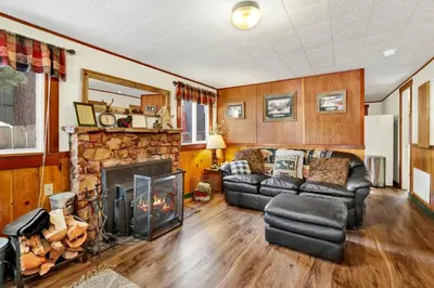 a living room with a couch and a fireplace at Green Squirrel Chateau #2484 in Big Bear Lake